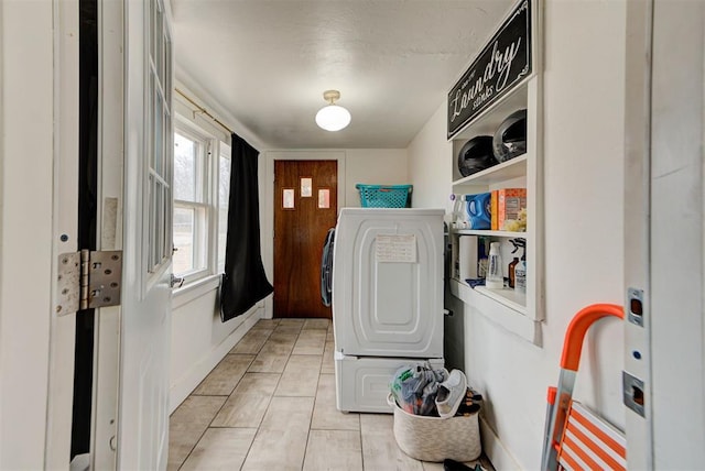 clothes washing area with washer / clothes dryer