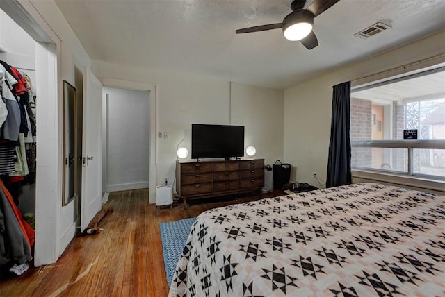 bedroom with hardwood / wood-style flooring and ceiling fan