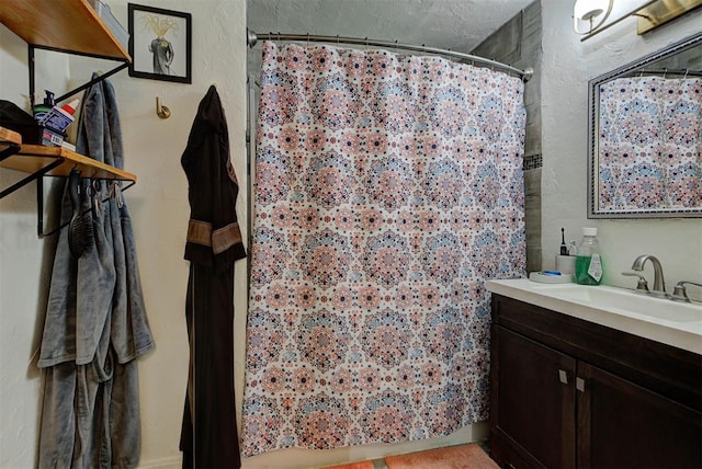 bathroom featuring vanity and a shower with curtain