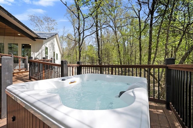 wooden terrace featuring a hot tub