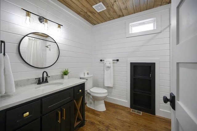 bathroom featuring walk in shower, toilet, wood ceiling, wood-type flooring, and vanity