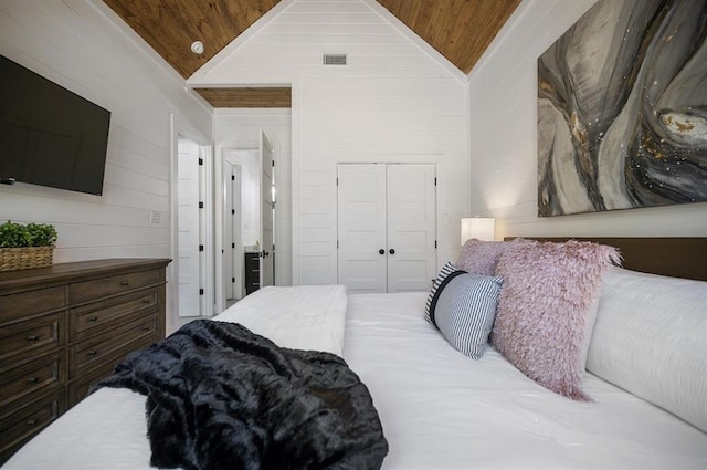 bedroom with high vaulted ceiling, wooden ceiling, and a closet