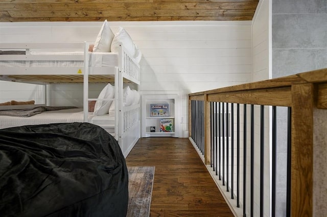 bedroom with dark wood-type flooring