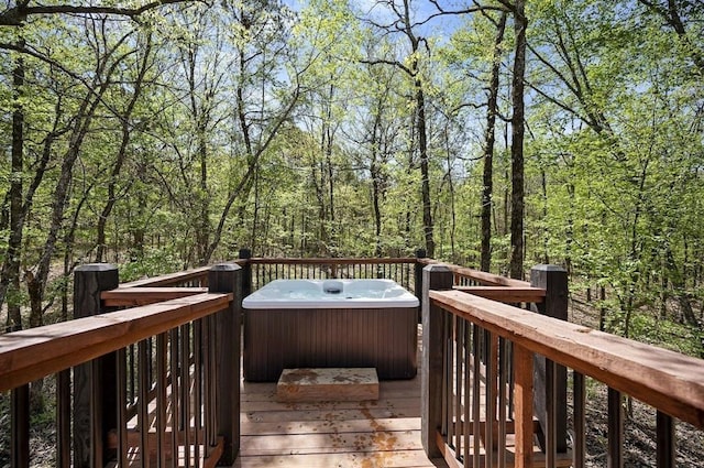 wooden terrace with a hot tub