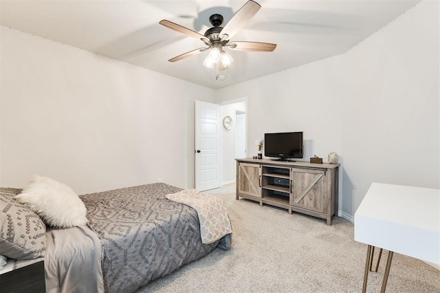 bedroom with ceiling fan and carpet