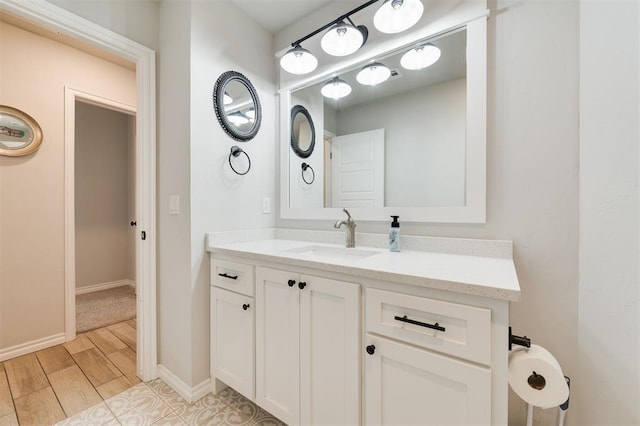 bathroom featuring vanity and wood-type flooring