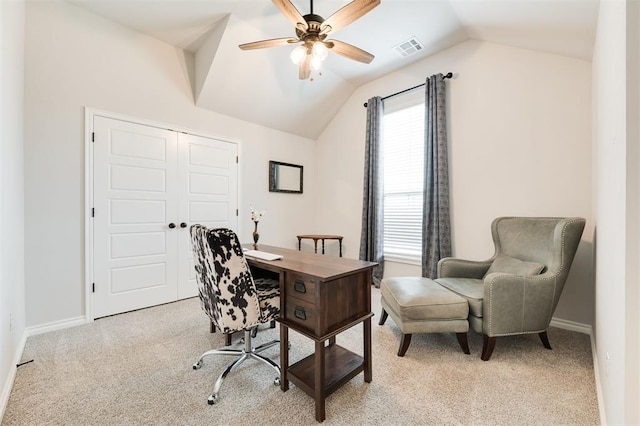 home office with lofted ceiling, light colored carpet, and ceiling fan