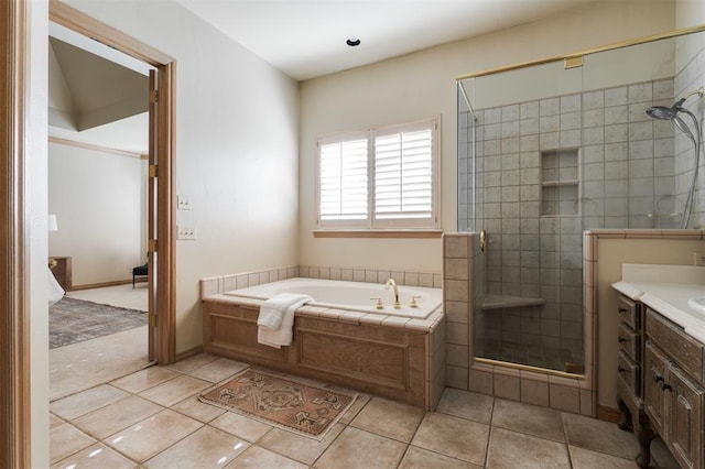 bathroom featuring tile patterned floors, vanity, and separate shower and tub