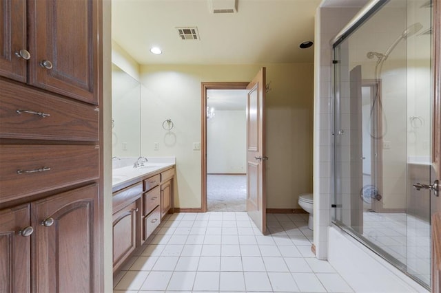 full bathroom featuring tile patterned flooring, vanity, enclosed tub / shower combo, and toilet