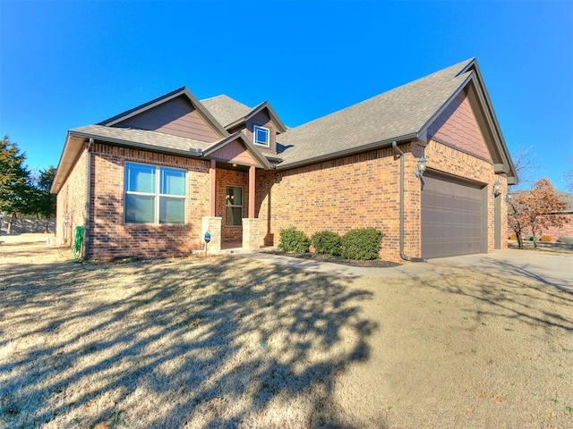 craftsman inspired home with a garage and a front yard