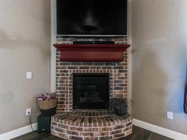 interior details with hardwood / wood-style flooring and a fireplace