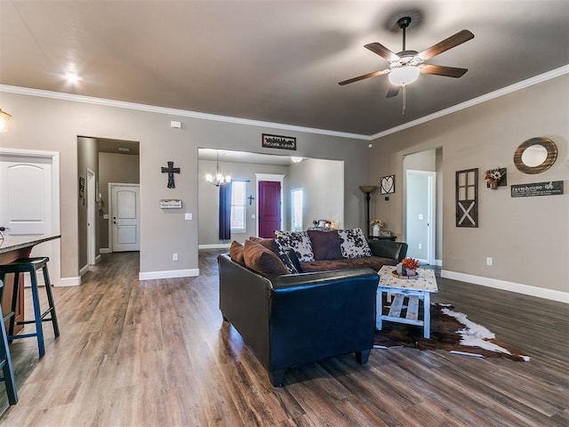 living room featuring ceiling fan, ornamental molding, and wood-type flooring