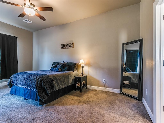 bedroom featuring ceiling fan and carpet