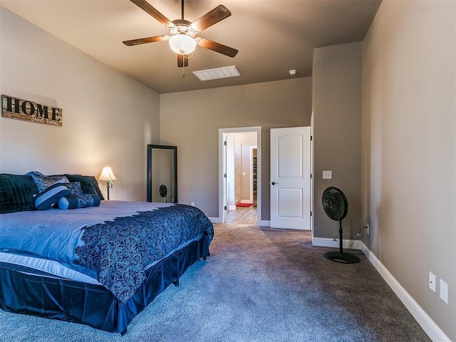 carpeted bedroom featuring connected bathroom and ceiling fan