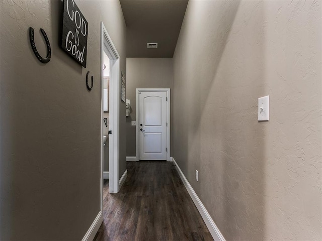 hall with dark wood-type flooring