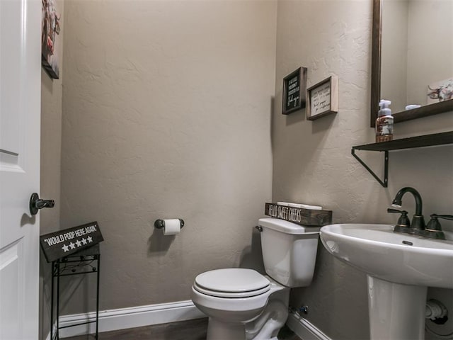 bathroom with sink and toilet