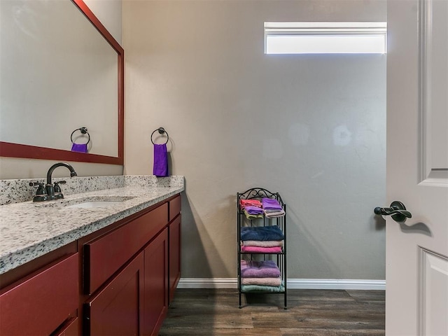 bathroom with vanity and hardwood / wood-style floors