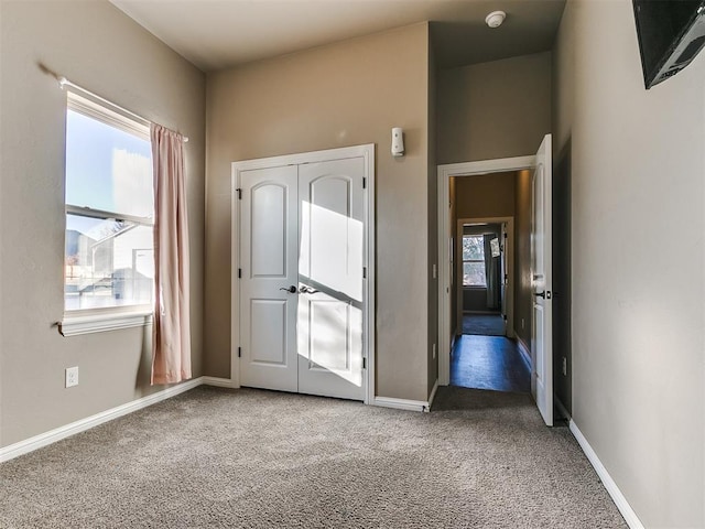 unfurnished bedroom featuring carpet floors