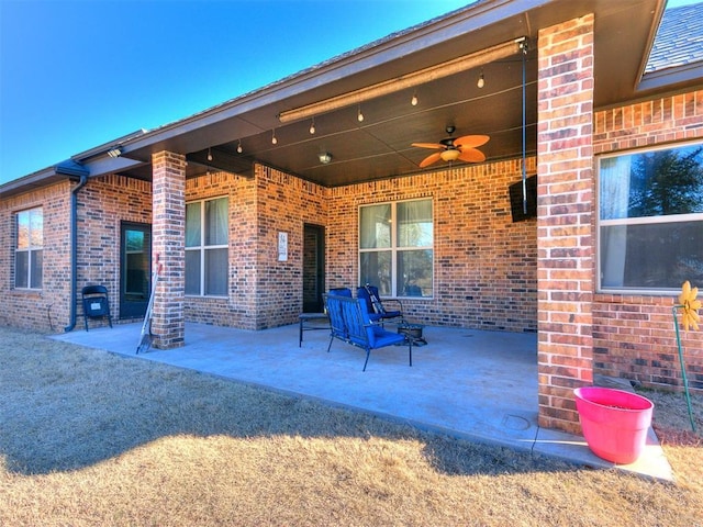 view of patio featuring ceiling fan