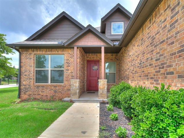 9015 Tall Oaks Dr, Guthrie, OK 73044 - property entrance featuring brick siding and a yard