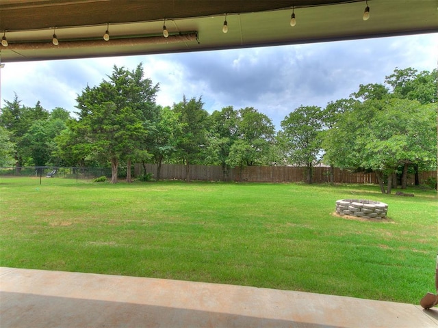 9015 Tall Oaks Dr, Guthrie, OK 73044 - view of yard featuring an outdoor fire pit