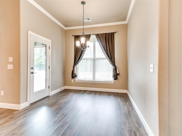 9015 Tall Oaks Dr, Guthrie, OK 73044 - unfurnished dining area with healthy amount of natural light, ornamental molding, dark wood-style flooring, baseboards, and a chandelier