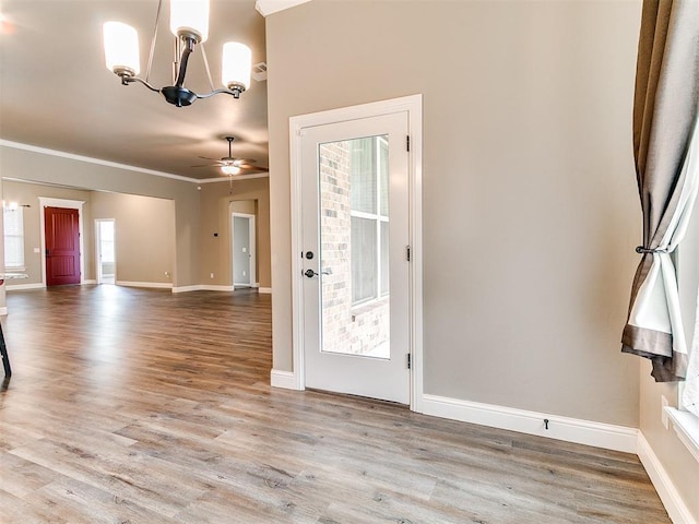 9015 Tall Oaks Dr, Guthrie, OK 73044 - foyer featuring a chandelier, wood finished floors, ceiling fan, crown molding, and baseboards