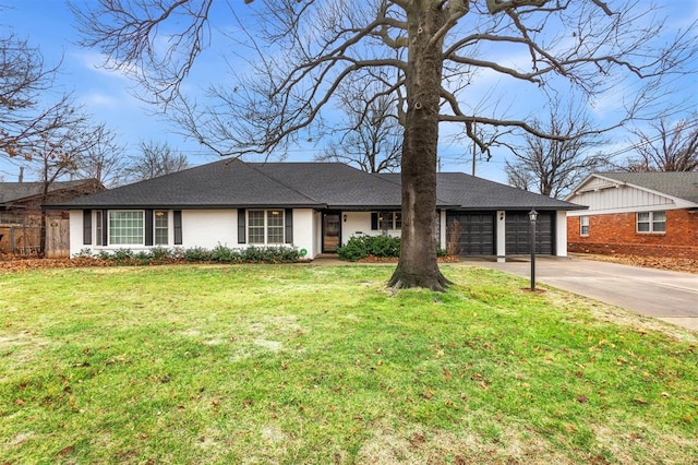 single story home featuring a garage and a front yard