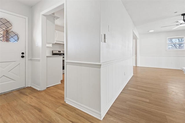 entrance foyer with ceiling fan and light hardwood / wood-style floors