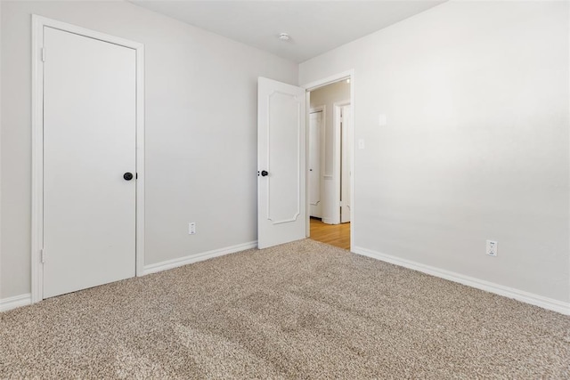 unfurnished bedroom with light carpet