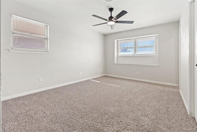 unfurnished room featuring carpet flooring and ceiling fan