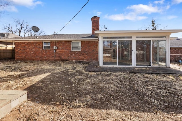 rear view of house with a sunroom