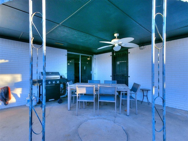 view of patio featuring ceiling fan and grilling area