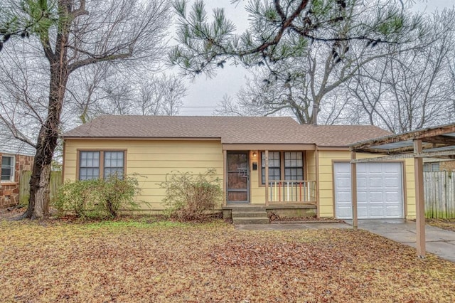 single story home with a garage and covered porch