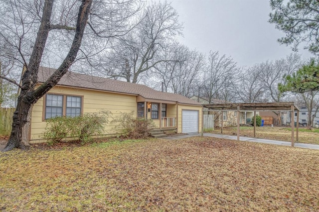 ranch-style home with a garage and a carport