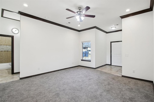 carpeted empty room with crown molding and ceiling fan