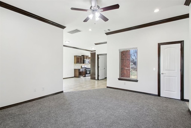 unfurnished living room with ceiling fan, ornamental molding, and light carpet