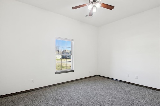 unfurnished room featuring ceiling fan and carpet flooring