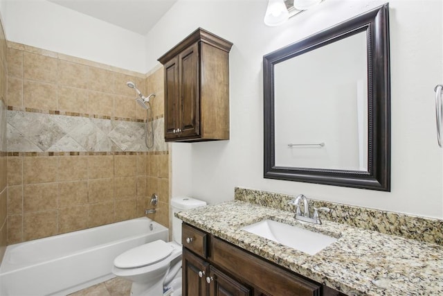 full bathroom with vanity, tile patterned flooring, tiled shower / bath combo, and toilet