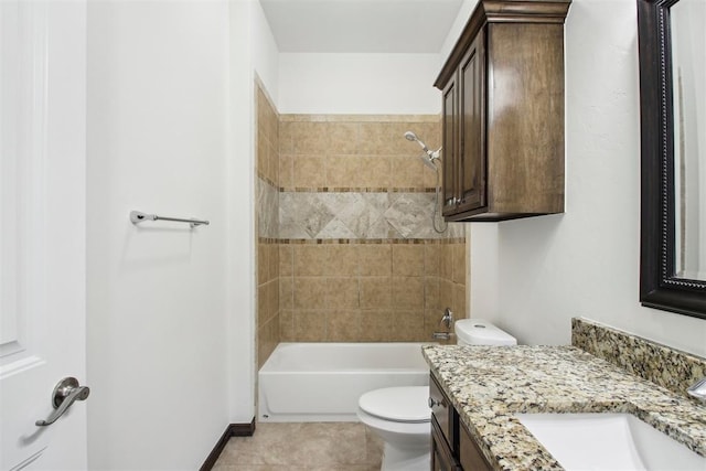 full bathroom featuring vanity, tile patterned flooring, tiled shower / bath combo, and toilet