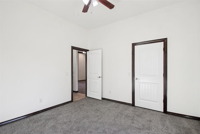 unfurnished bedroom featuring ceiling fan and carpet floors