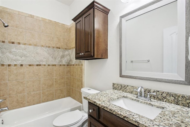 full bathroom featuring vanity, toilet, and tiled shower / bath