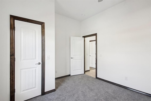 unfurnished bedroom featuring light carpet