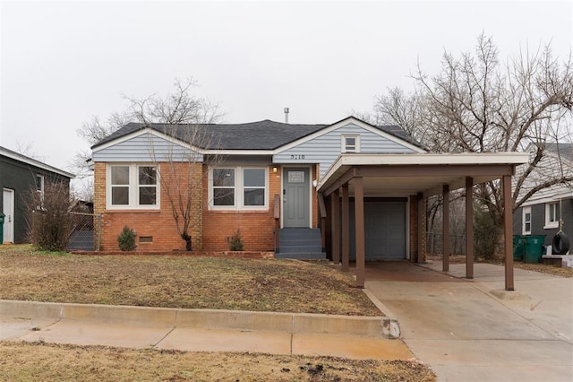 view of front of home featuring a carport and a garage