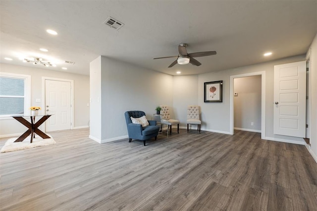 sitting room featuring hardwood / wood-style floors and ceiling fan