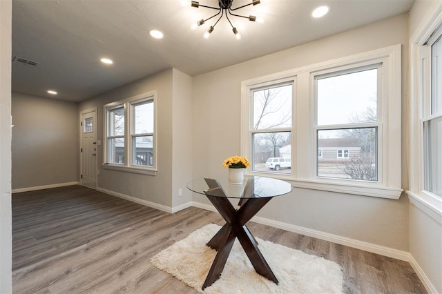 doorway with hardwood / wood-style floors