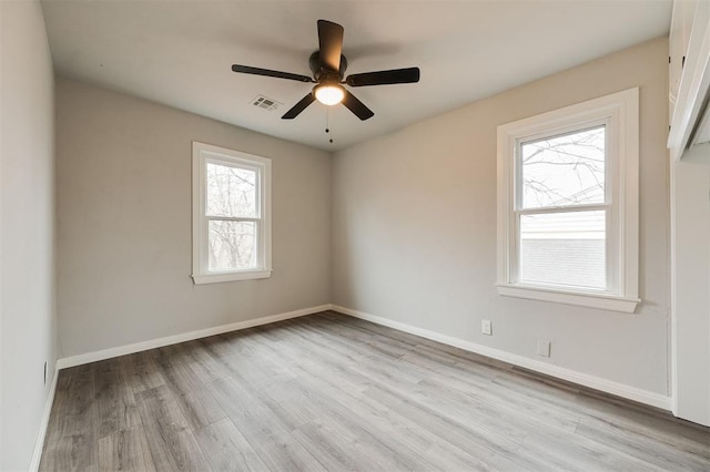 empty room with light hardwood / wood-style floors and ceiling fan