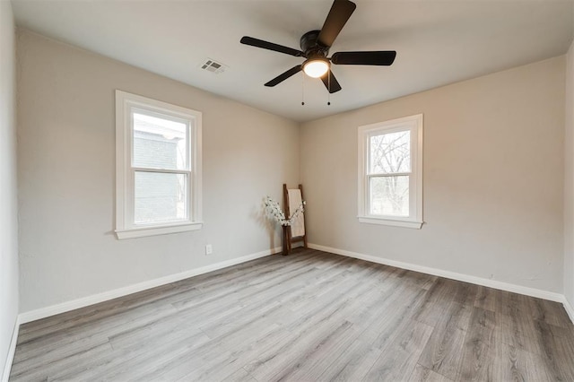 unfurnished room with light hardwood / wood-style flooring and ceiling fan