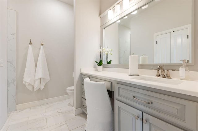 bathroom featuring baseboards, a shower, toilet, marble finish floor, and vanity