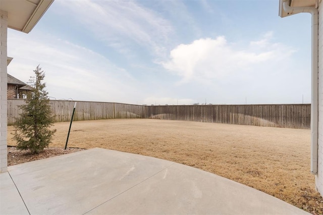 view of yard featuring a patio area and a fenced backyard